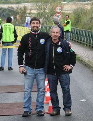 A couple of men standing on a road

AI-generated content may be incorrect.